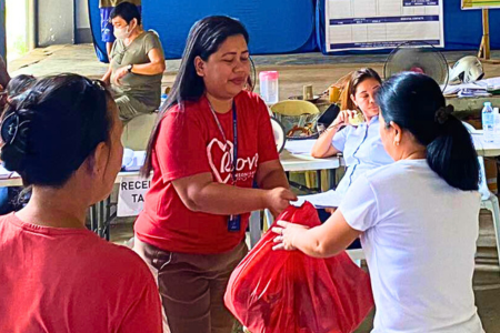 Trooping to the evacuation site, employee volunteers donated family relief packs to more than 100 families from Brgy. Cogon. 