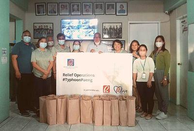 RLove imparts relief packs to employees and communities affected by Typhoon Paeng in Dasmarinas