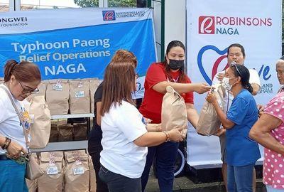 RLove sends relief packs to employees and communities affected by Typhoon Paeng in Naga
